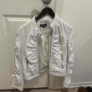 LaMarque 💯 lamb leather. So soft. Slight dirt. Can be dry cleaned.